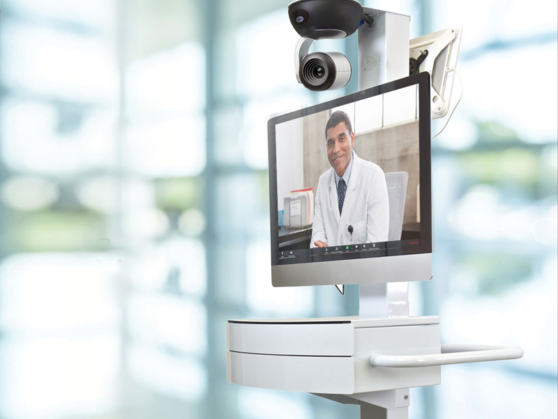 Telehealth cart with a telemedicine specialist on the screen ready to provide care.